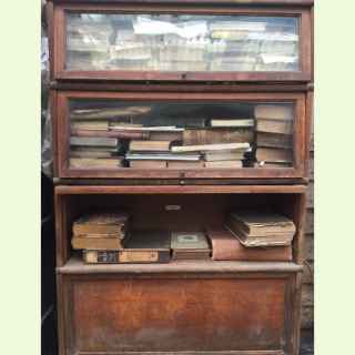 Globe Wernicke oak four tier glazed and wood Sectional Bookcase.
