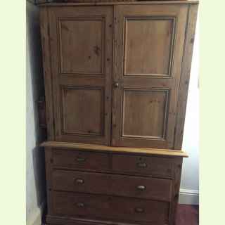 Large antique pine cupboard with drawers.