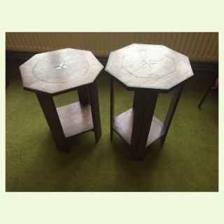 2 Small two-tiered octagonal art deco side tables with geometric parquetry decorations.